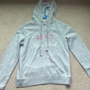 Grey hoodie, no pockets, no thumb holes. Good condition. Very comfortable.